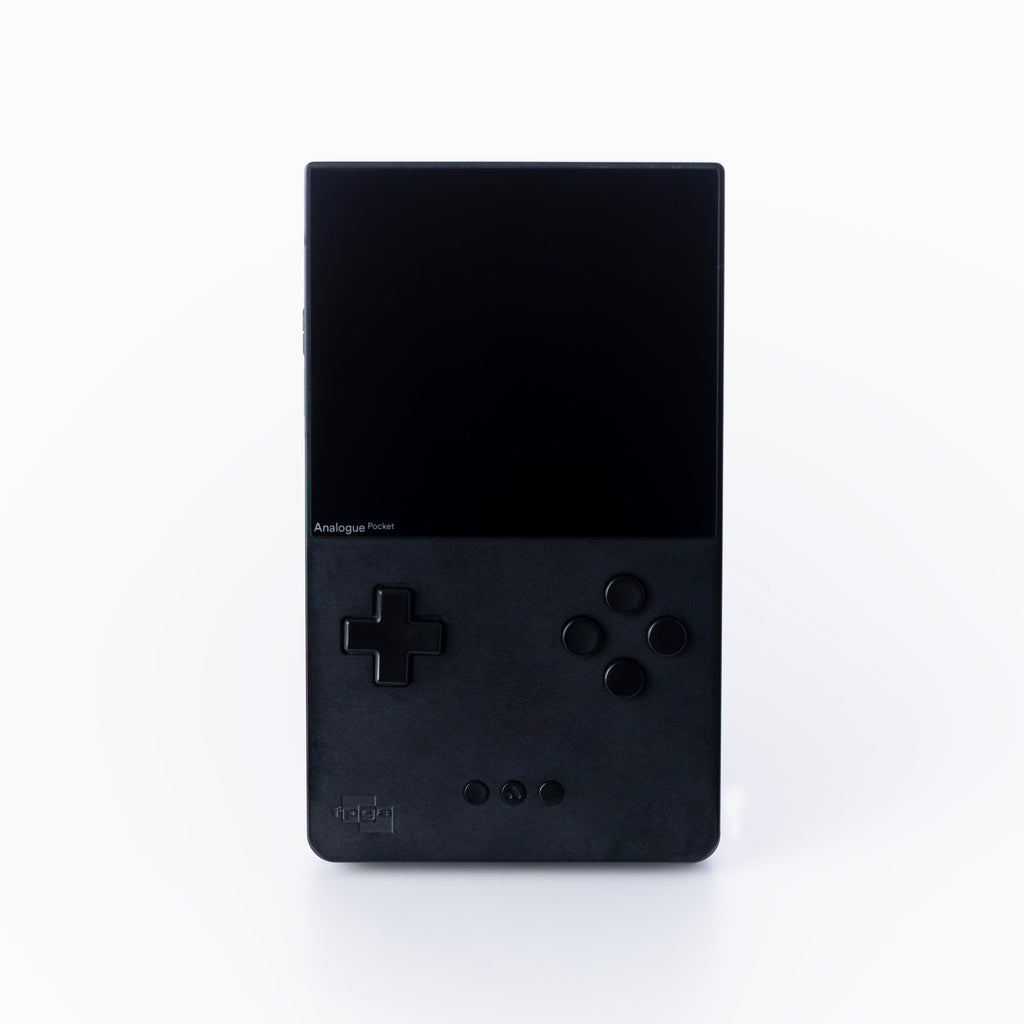 A black Analogue Pocket console standing vertically against a clean off white background.