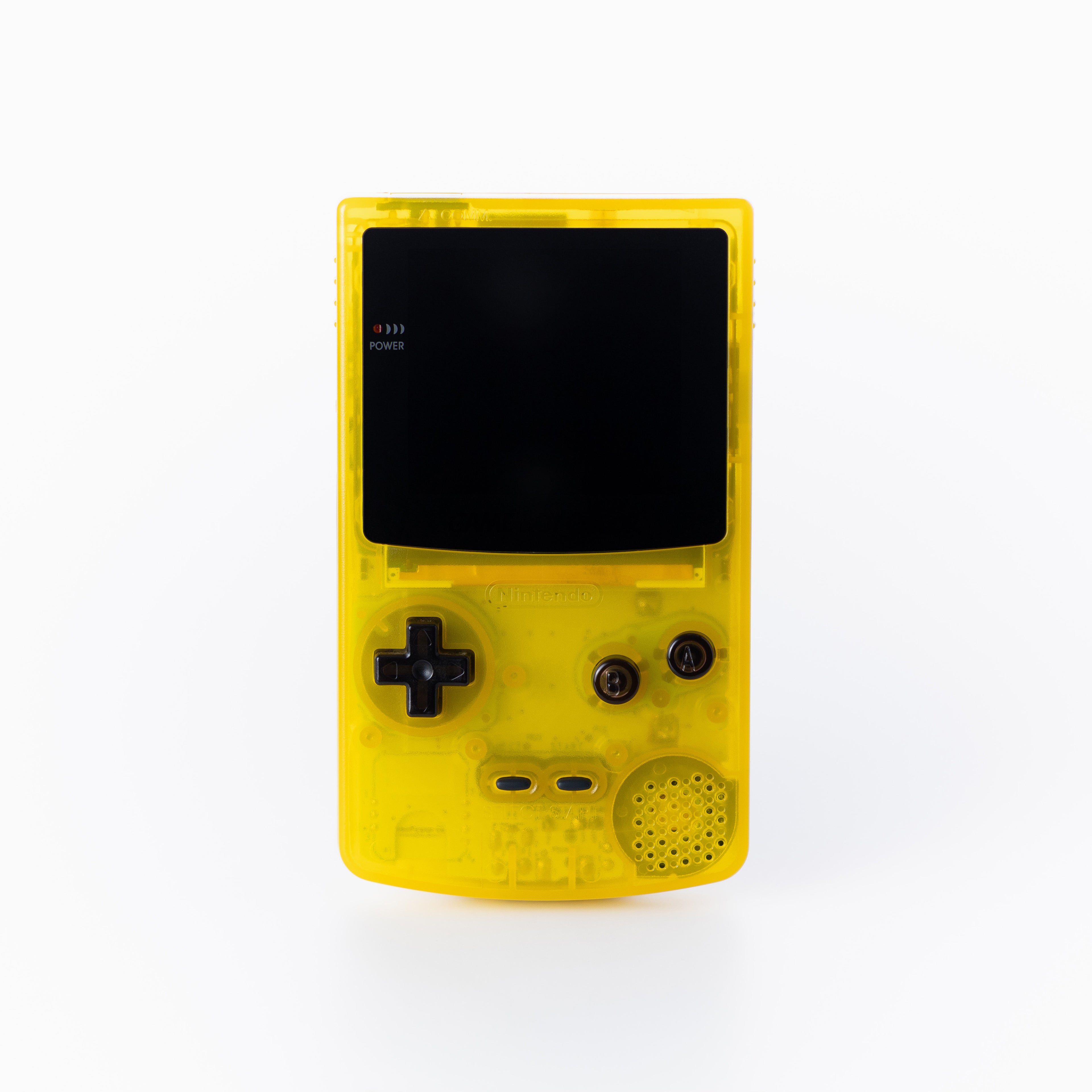 A translucent yellow game boy color with on display, shown against a plain off white background.